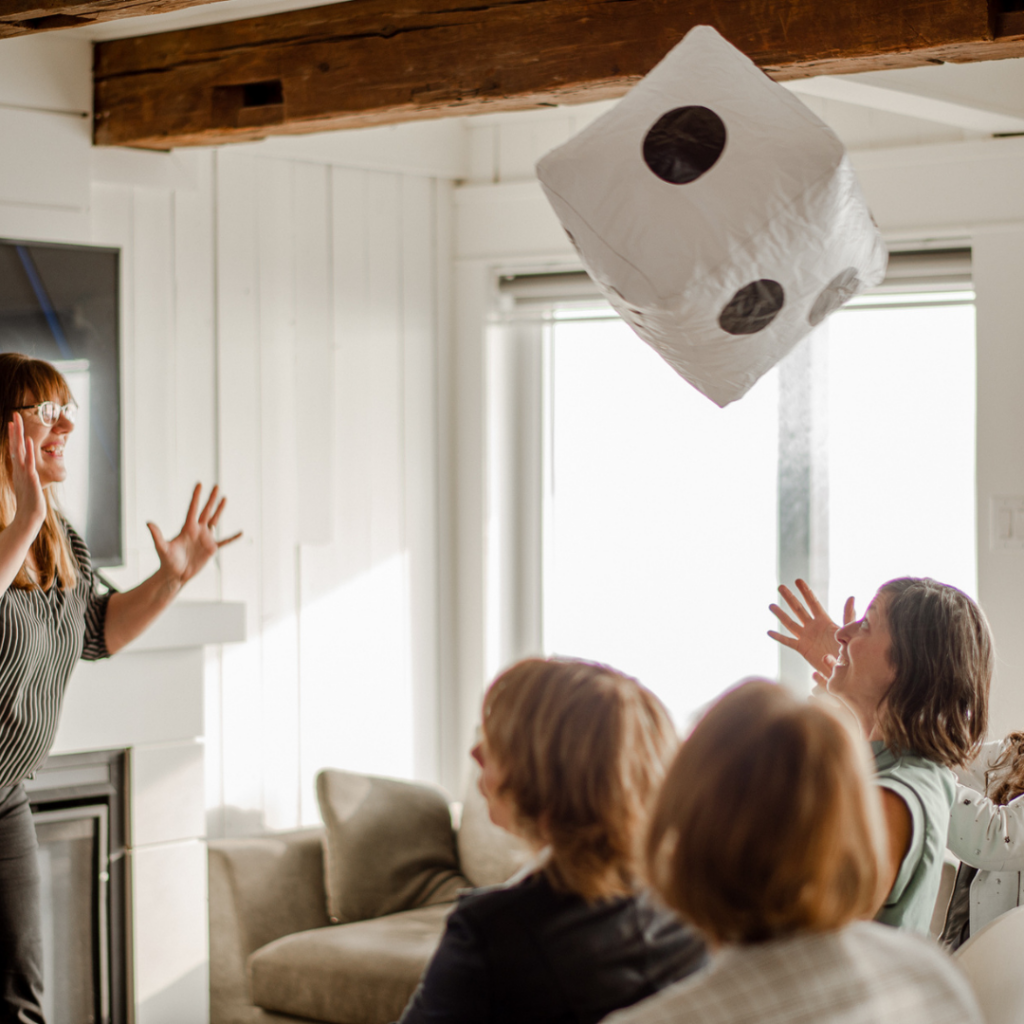 Patricia throwing a large blown up dice to workshop participants. Summer Shorts Season Four.