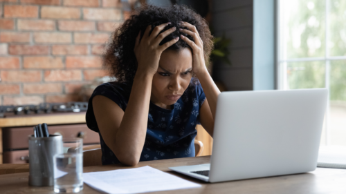 person looking at computer confused