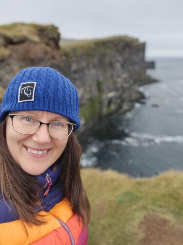 Need the edge but not too close, Patricia at the Latrabjarg Cliffs in Iceland.