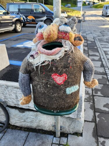 Iceland knitted troll on a garbage can 