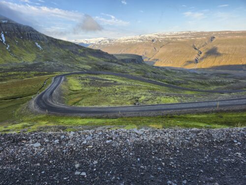 Iceland epic switch back roads up, over and down mountain drives.