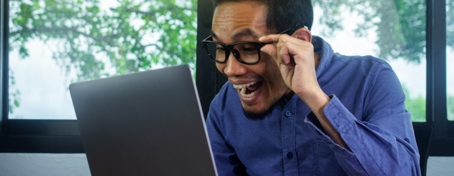 Person looking at a laptop excited and the AI discovery.